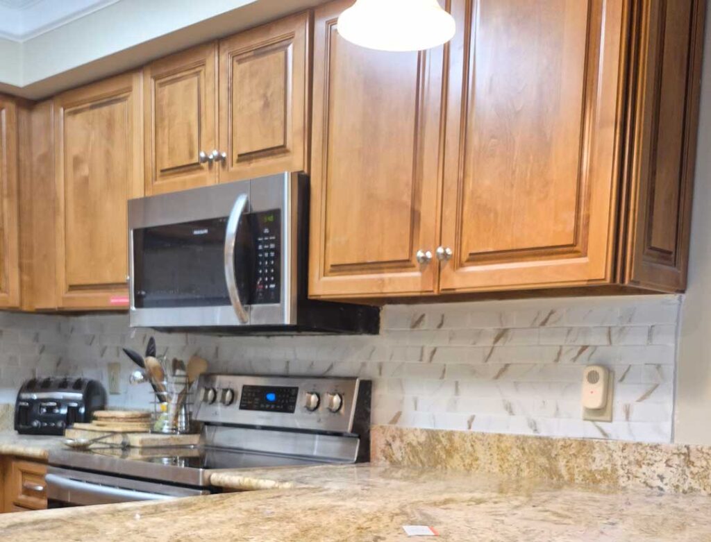 Tile Backsplash - cut and install tile to make a backspash